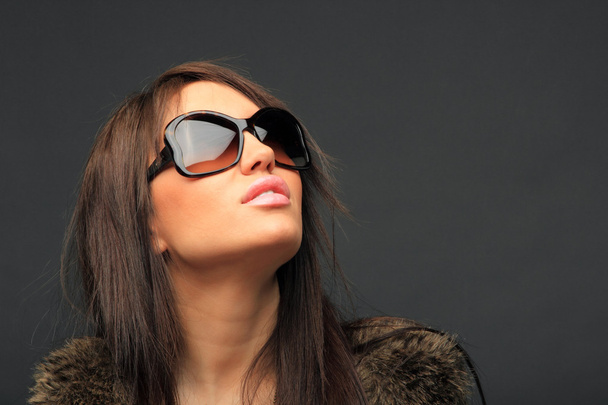 beautiful long hair brunette woman wearing sunglasses - 写真・画像