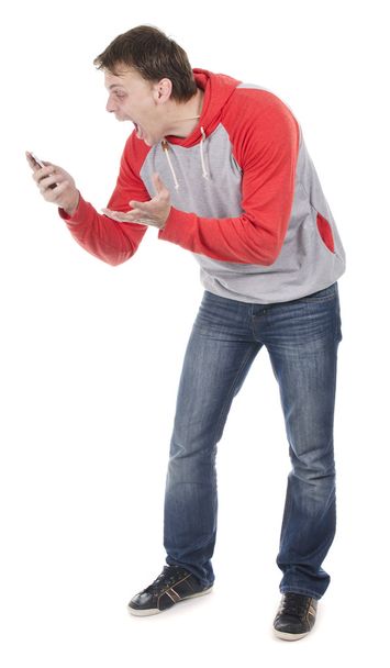Man shouting to telephone - Foto, afbeelding