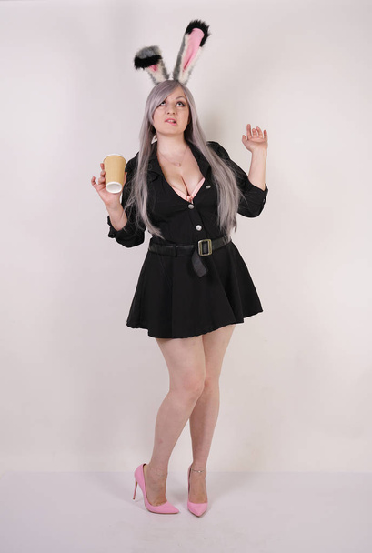 cute chubby anime girl with a coffee in a paper Cup on a white background in the Studio - Photo, Image