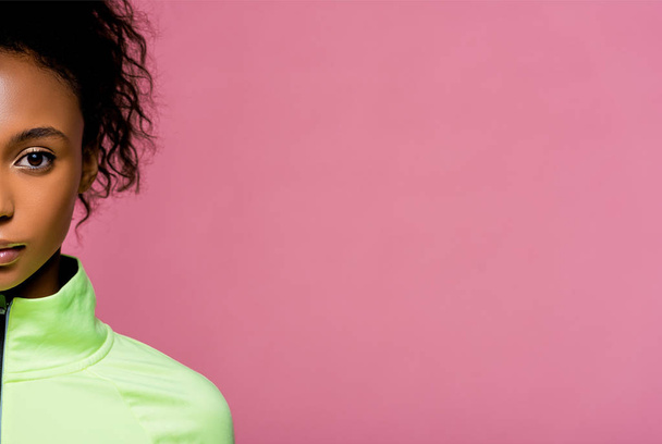 cropped view of beautiful african american sportswoman looking at camera isolated on pink with copy space - Foto, Imagem
