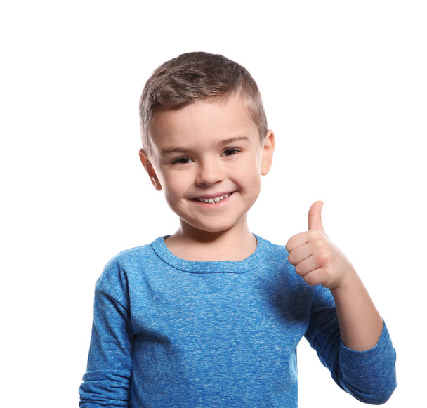 Little boy showing THUMB UP gesture in sign language on white background - Zdjęcie, obraz