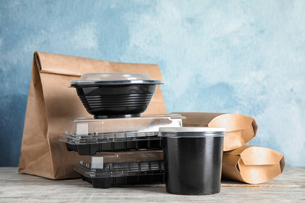 Various takeout containers on table. Food delivery service - Φωτογραφία, εικόνα