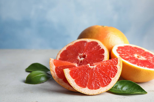 Fresh tasty grapefruits on table. Space for text - Foto, imagen