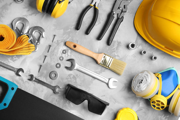 Flat lay composition with different construction tools on grey background - Zdjęcie, obraz