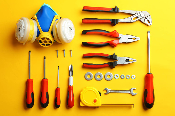 Flat lay composition with construction tools on color background - 写真・画像