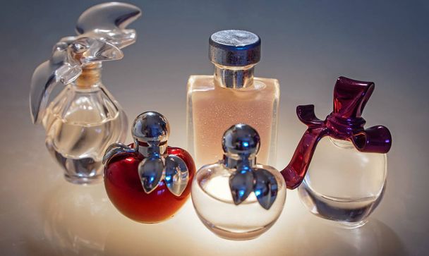 Beautiful modern glass bottles for women's perfume - Фото, изображение