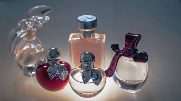 Beautiful modern glass bottles for women's perfume - Фото, изображение