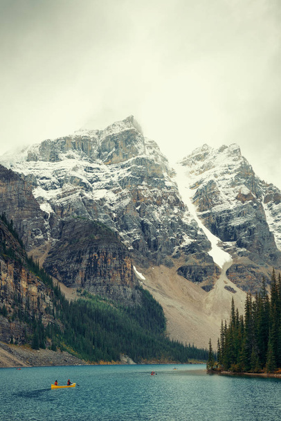 Moraine Lake with snow capped mountain of Banff National Park in Canada - Photo, Image