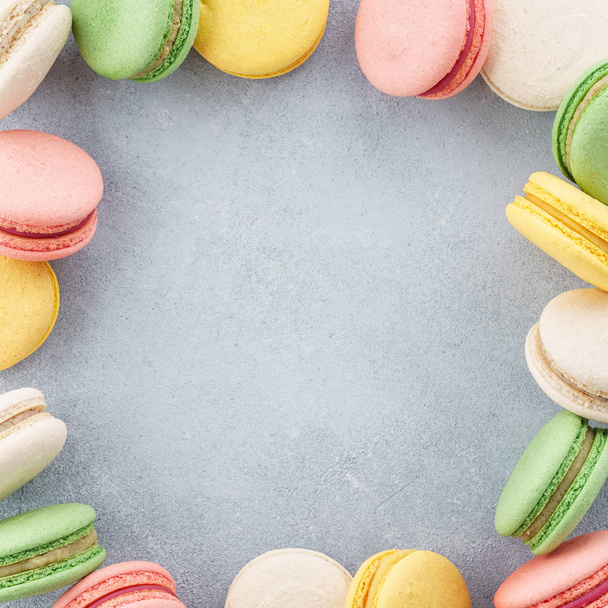 Frame made of colorful french macarons. Creative background. - Foto, Imagem