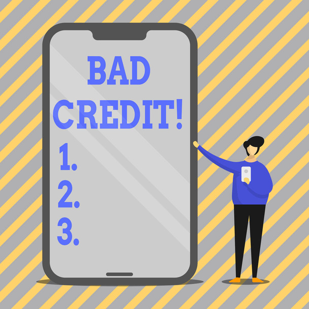 Writing note showing Bad Credit. Business photo showcasing offering help after going for loan then getting rejected Man Presenting Huge Smartphone while Holding Another Mobile. - Photo, Image