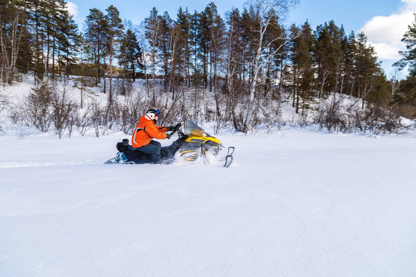 Athlete on a snowmobile. - Photo, Image