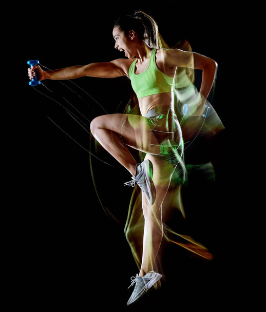 woman exercising fitness exercises isolated black background lightpainting effect - Photo, Image