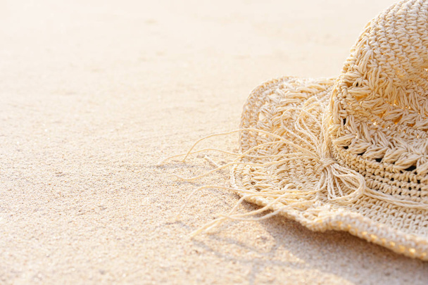 Background of Sand beach with accessories straw hat in summer time - Fotó, kép