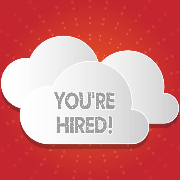 Conceptual hand writing showing You Re Hired. Business photo showcasing Used by huanalysis resources indicate employee that he is got job White Clouds Cut Out of Board Floating on Top of Each Other. - Photo, Image