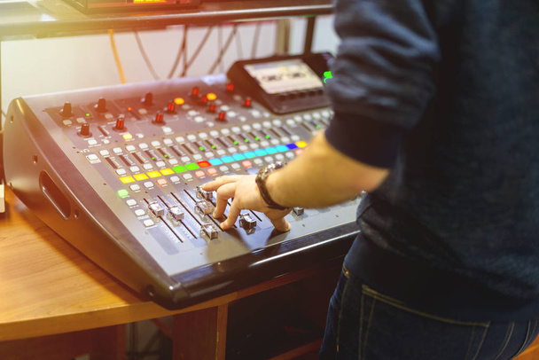 man using mixing console in sound recording studio - Foto, Imagen