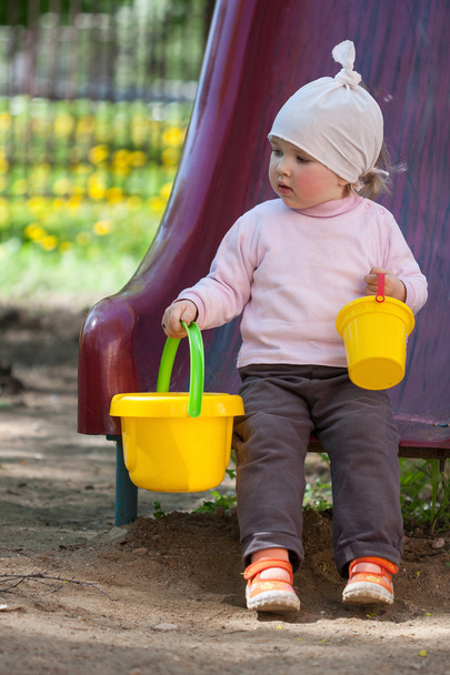 Pretty little girl playing on a playground - Fotografie, Obrázek