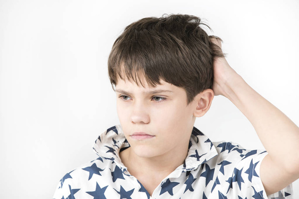 Portrait of an emotional boy on a white background.  - Foto, Bild