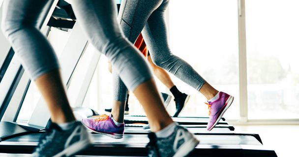 Picture of people doing cardio training on treadmill in gym - 写真・画像
