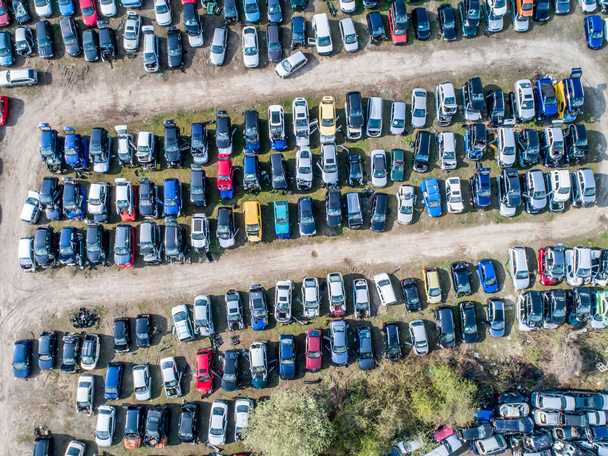 Lines of crushed cars wreck in scrapyard before being shredded recyling - Фото, зображення