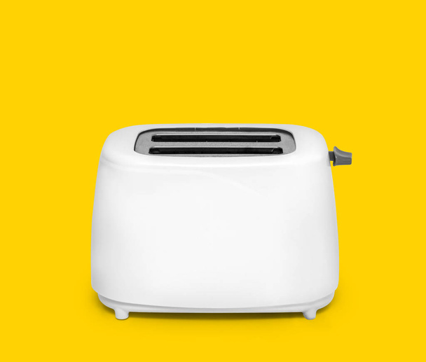 Сучасний тостер на жовтому
 - Фото, зображення