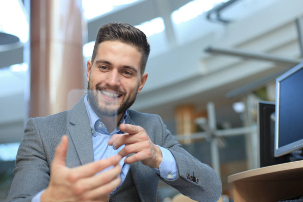 Future concept. Businessman holds futuristic transparent smart phone. - Foto, immagini