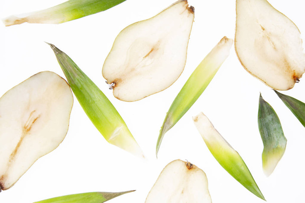 Pears and leafs on a white background. - Zdjęcie, obraz