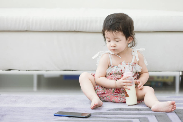 Portrait of cute asian baby girl with smartphone. - Fotografie, Obrázek