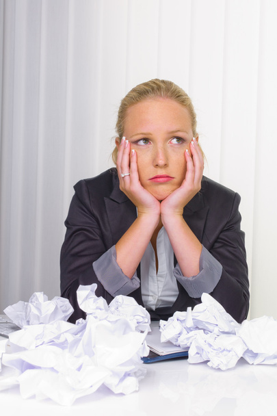 Woman in office with crumpled paper - Fotó, kép