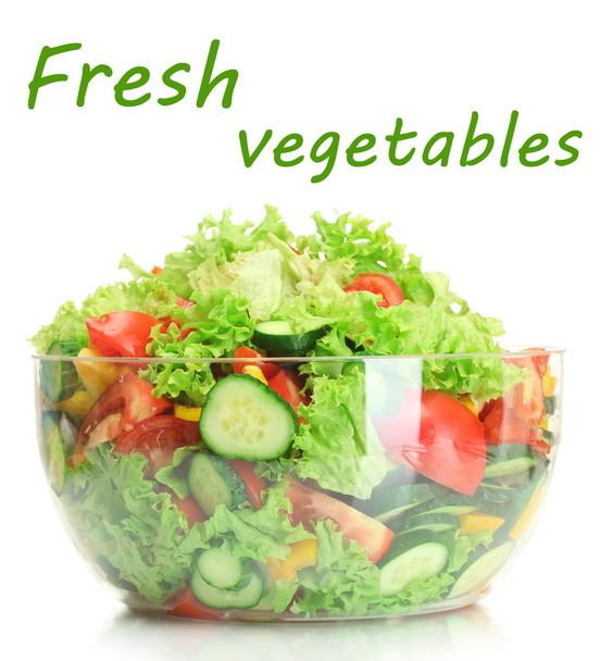 Fresh vegetable salad in transparent bowl isolated on white - Photo, Image