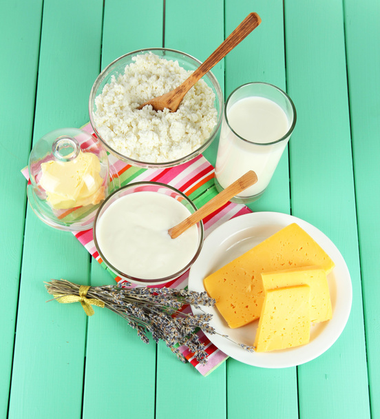Glass of milk and cheese on a wooden background - Fotografie, Obrázek