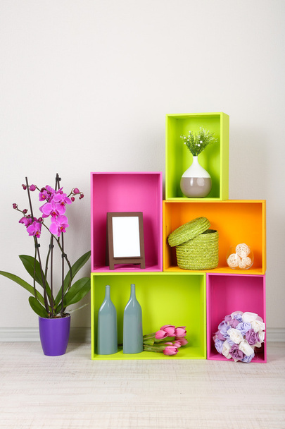 Beautiful colorful shelves with different home related objects - Foto, afbeelding