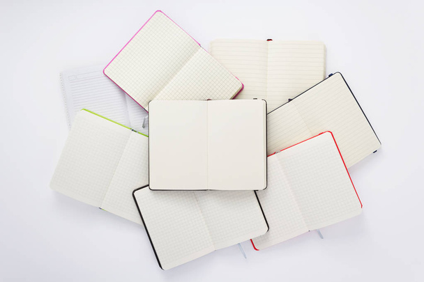 paper notebook at white background - Φωτογραφία, εικόνα