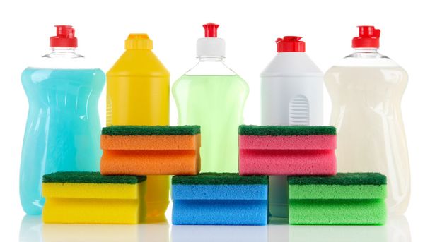 Bottles of dishwashing liquid and colorful sponges, isolated on white - Foto, afbeelding