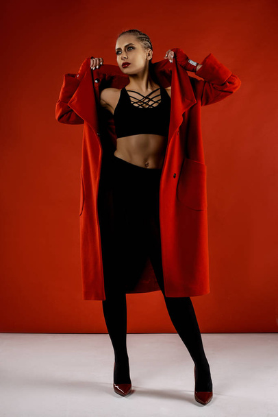 sexy young beautiful woman in red gloves   posing in studio - Фото, зображення