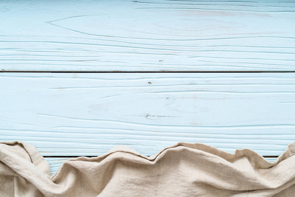 kitchen cloth (napkin) on blue wooden background - Fotoğraf, Görsel