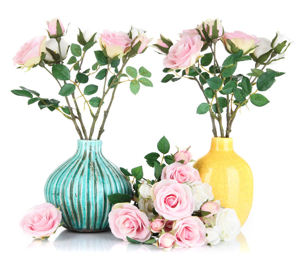 Beautiful pink and white roses in vases isolated on white - Foto, afbeelding