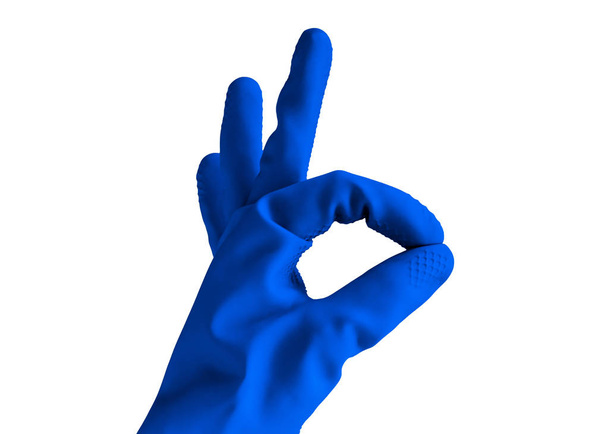 hand in rubber blue glove shows ok sign, isolated object on white background . cleaning concept - Valokuva, kuva