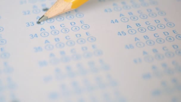 The student fills in the examination form of the test - Footage, Video