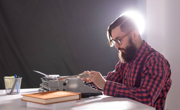 people, writer and hipster concept - young stylish writer working on typewriter - Fotó, kép