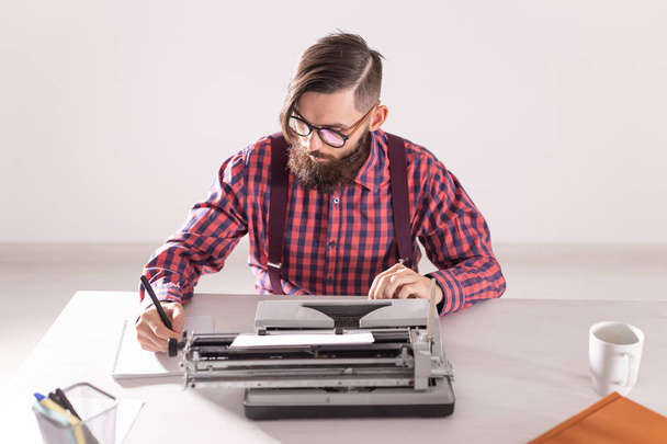 people, world day of writer and hipster concept - young stylish journalist working on typewriter - Фото, зображення