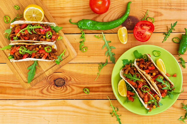 Mexican tacos with beef in tomato sauce - Photo, Image