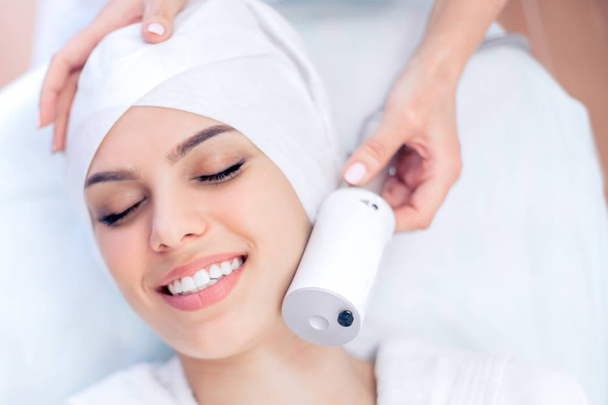 Cosmetology. Apparatus facial massage. Lifting, rejuvenation. Cosmetology clinic - Фото, изображение