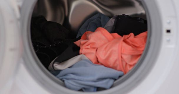 Load clothes to washer machine - Foto, Imagen