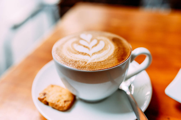 A cup of flavored cappuccino cafe in a good cafe - 写真・画像