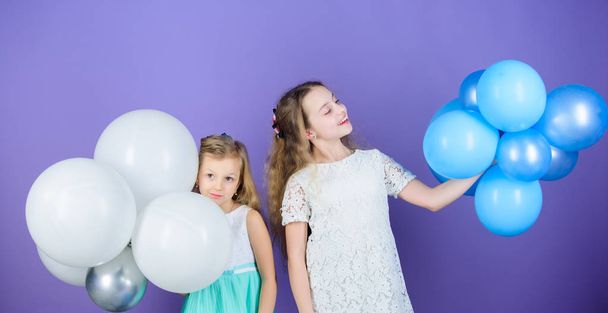 An amazing day with full of fun. Little girls celebrating birthday anniversary with air balloons. Adorable kids enjoy birthday celebration. Small children having birthday party. Happy birthday to you - Fotó, kép