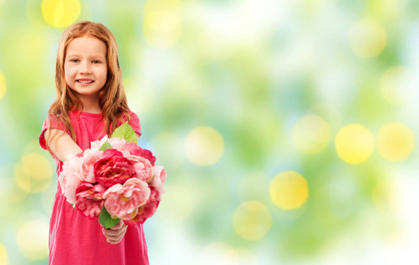 happy red haired girl with flowers - Zdjęcie, obraz