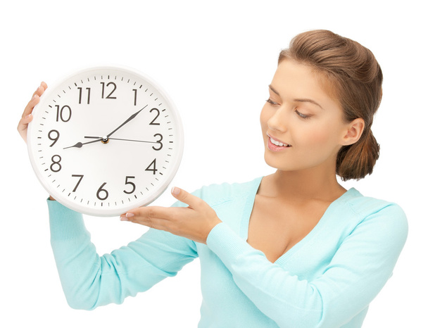 Woman with wall clock - Foto, imagen