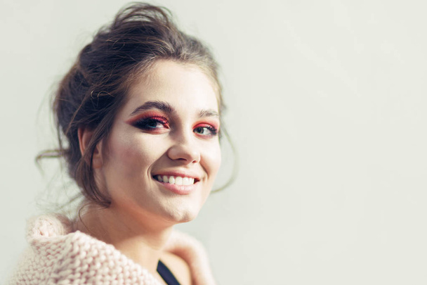 Beautiful smiling girl with bright red make-up on a white background - Φωτογραφία, εικόνα