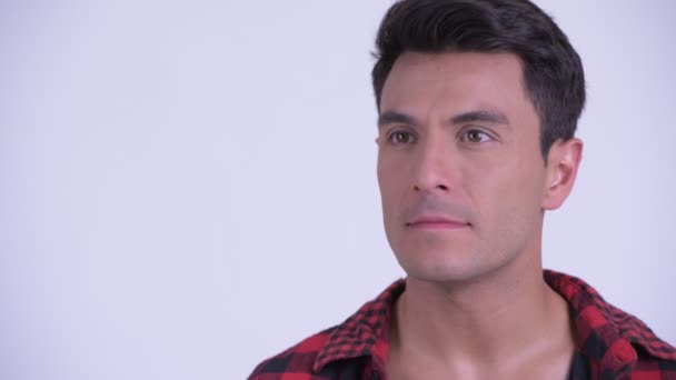 Face of happy young Hispanic hipster man thinking - Felvétel, videó