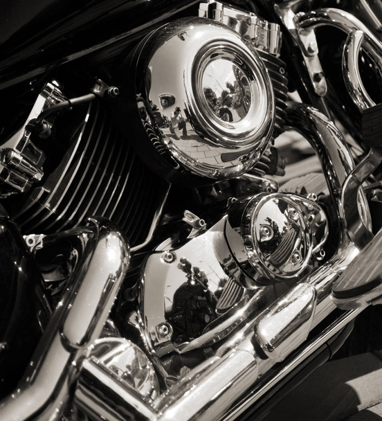 Closed chromed motorcycle engine. Small details in reflection - Photo, Image